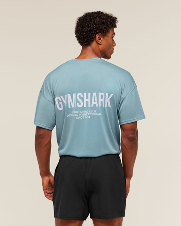 تيشيرت بشعار كونديشنينغ كلوب بقصة فضفاضة