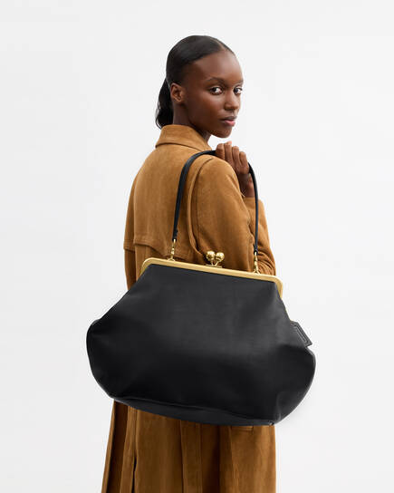 Buy COACH Large Kisslock Frame Bag Black Online in UAE