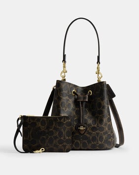 Rowan Bucket Bag In Loved Signature Canvas With Charms