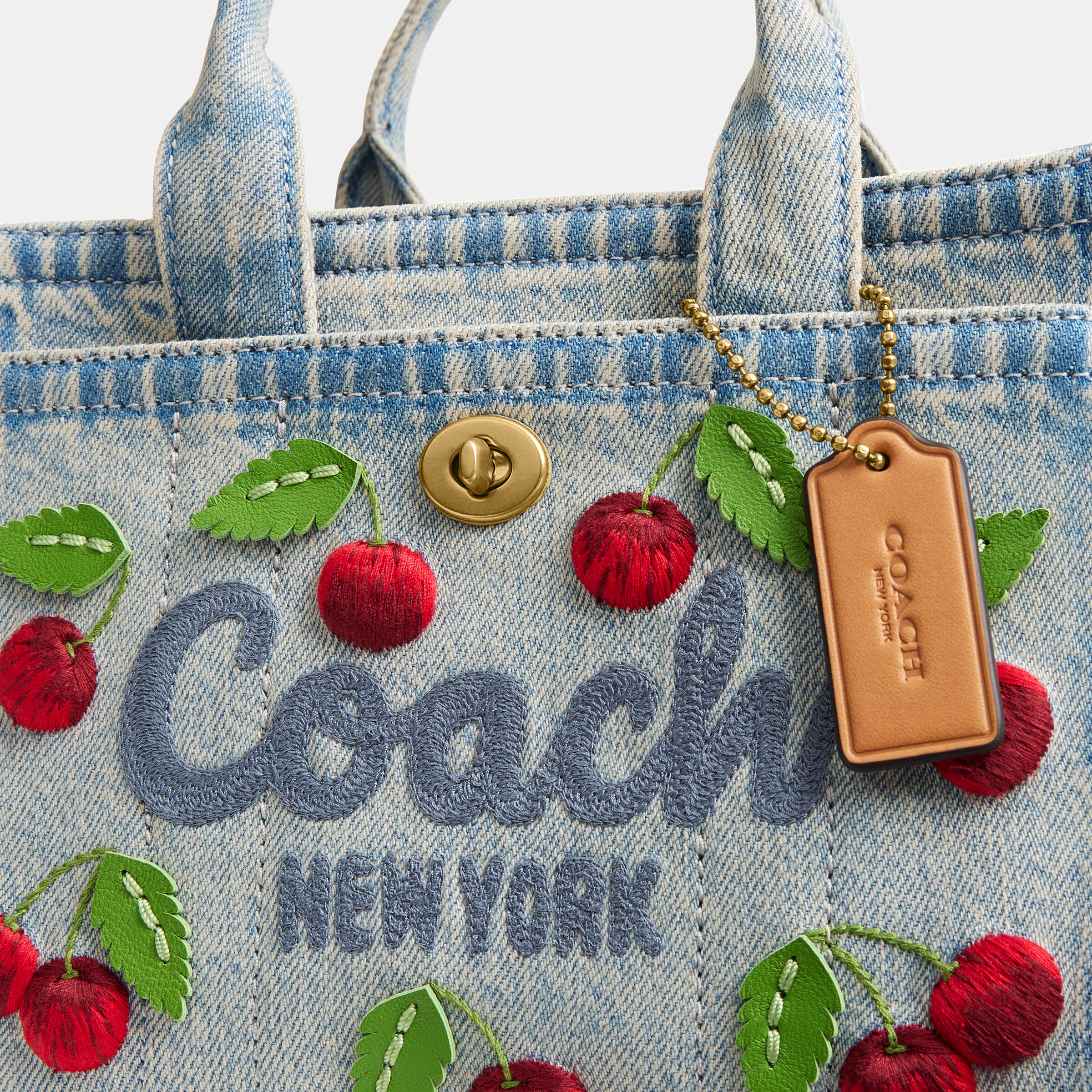 Buy COACH Embroidered Cherry Denim Cargo Tote 20 Blue Online in UAE