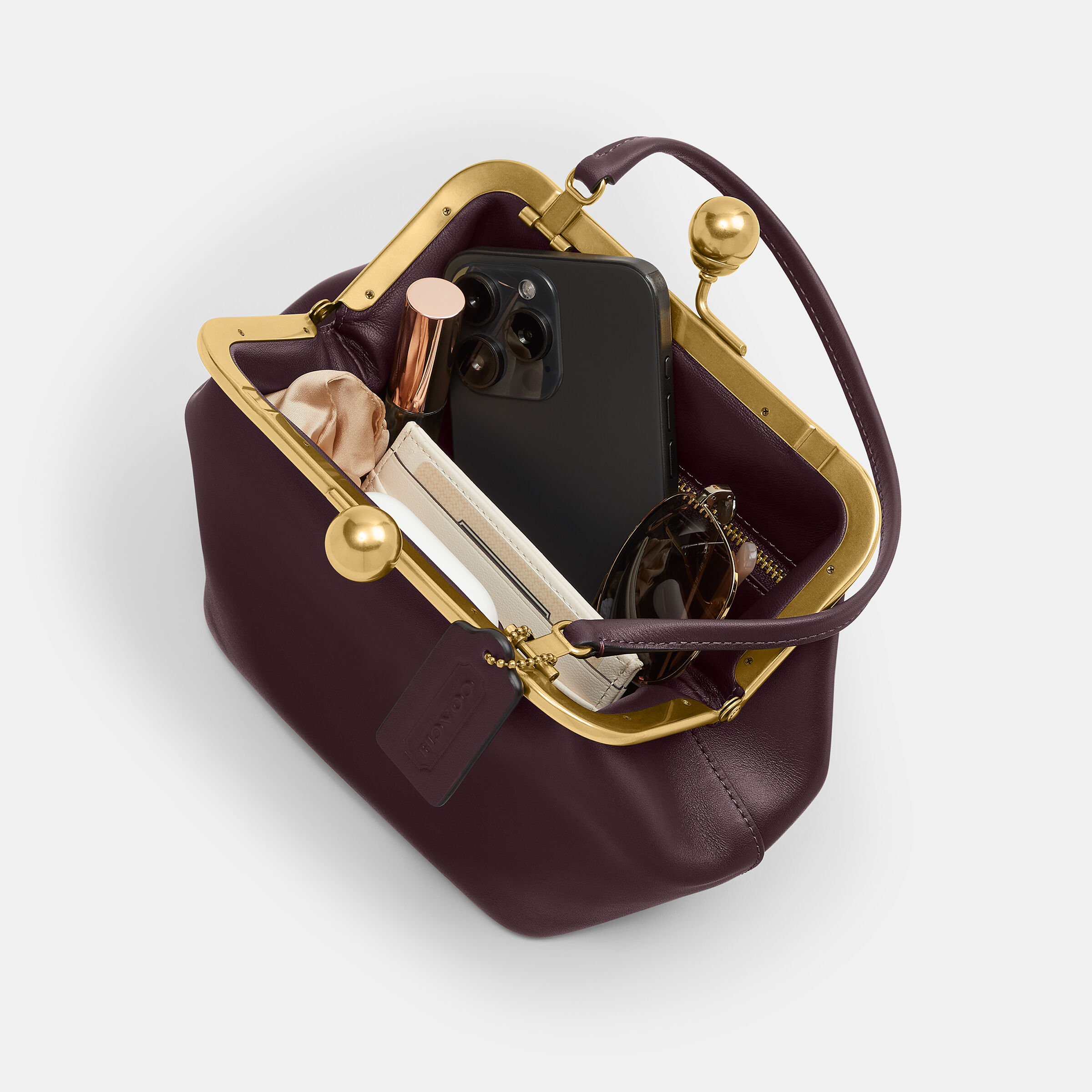 Buy COACH Kisslock Frame Bag 16 Dark Purple Online in UAE Buy COACH Kisslock Frame Bag 16 Dark Purple Online in UAE