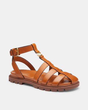 صندل فيشرمان بحلية شعار الماركة بتصميم منحوت