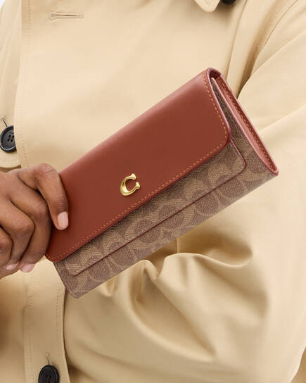Buy COACH Mila Long Flap Wallet In Signature Canvas Light/Pastel 