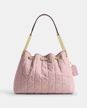 Evelyn Shoulder Bag In Loved Denim With Quilting And Charm