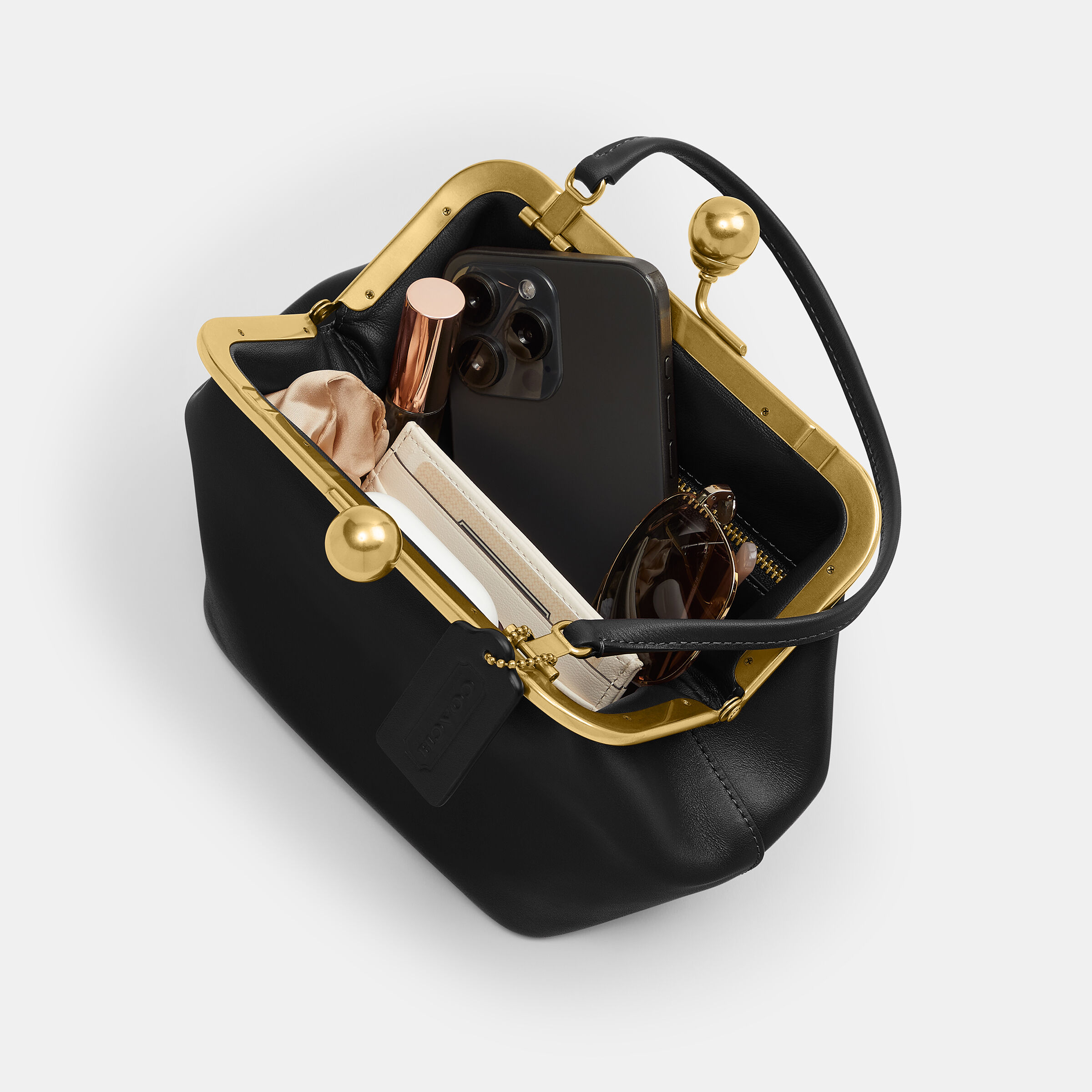 Buy COACH Kisslock Frame Bag 16 Black Online in UAE