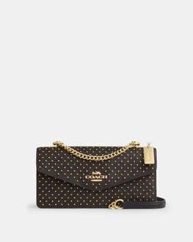 Klare Envelope Crossbody Bag In Signature Canvas With Rivets