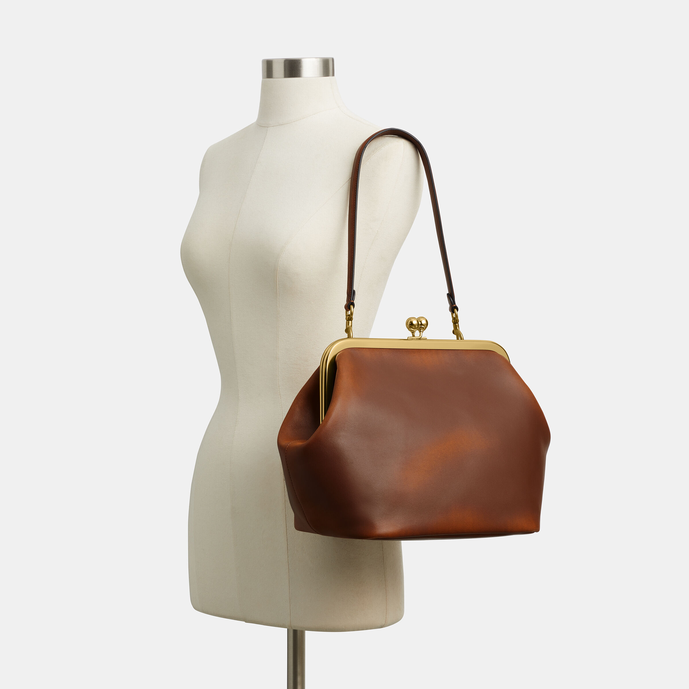 Buy COACH Loved Leather Kisslock Frame Bag 27 Brown Online in UAE