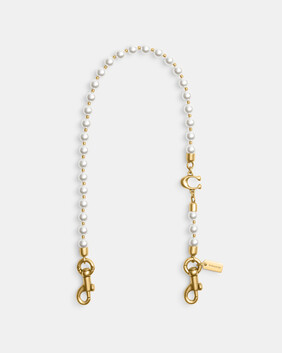 حمالة قصيرة مرصعة بلؤلؤ