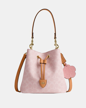 Rowan Bucket Bag In Signature Canvas With Charms